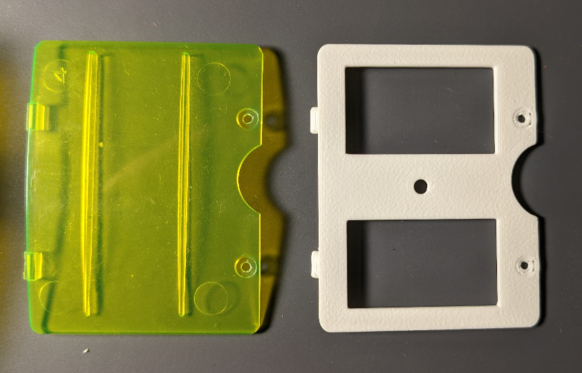 original Cybiko battery compartment door (left) and the 3D printed part (right)