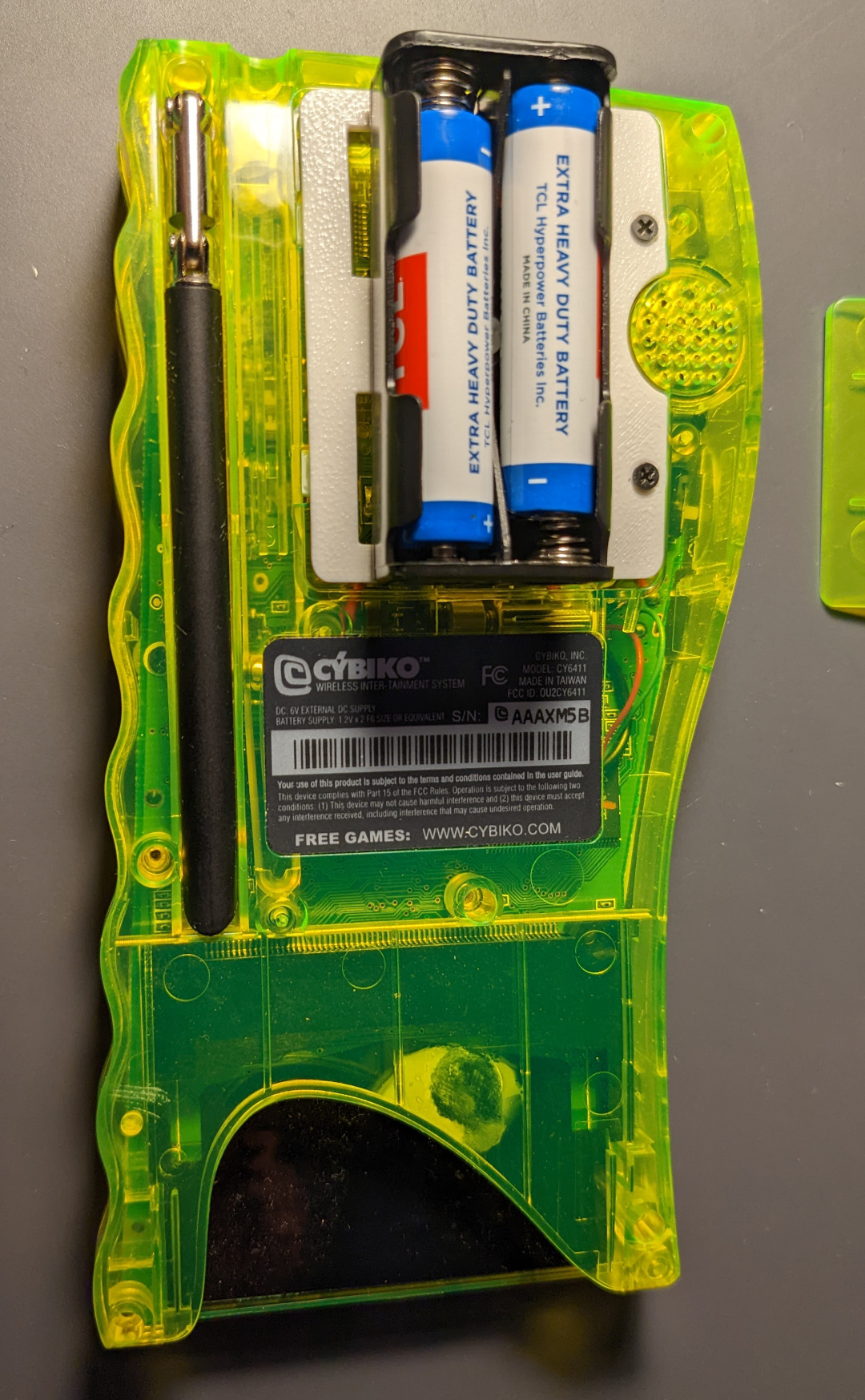 Cybiko assembled with replacement battery compartment door and external battery compartment